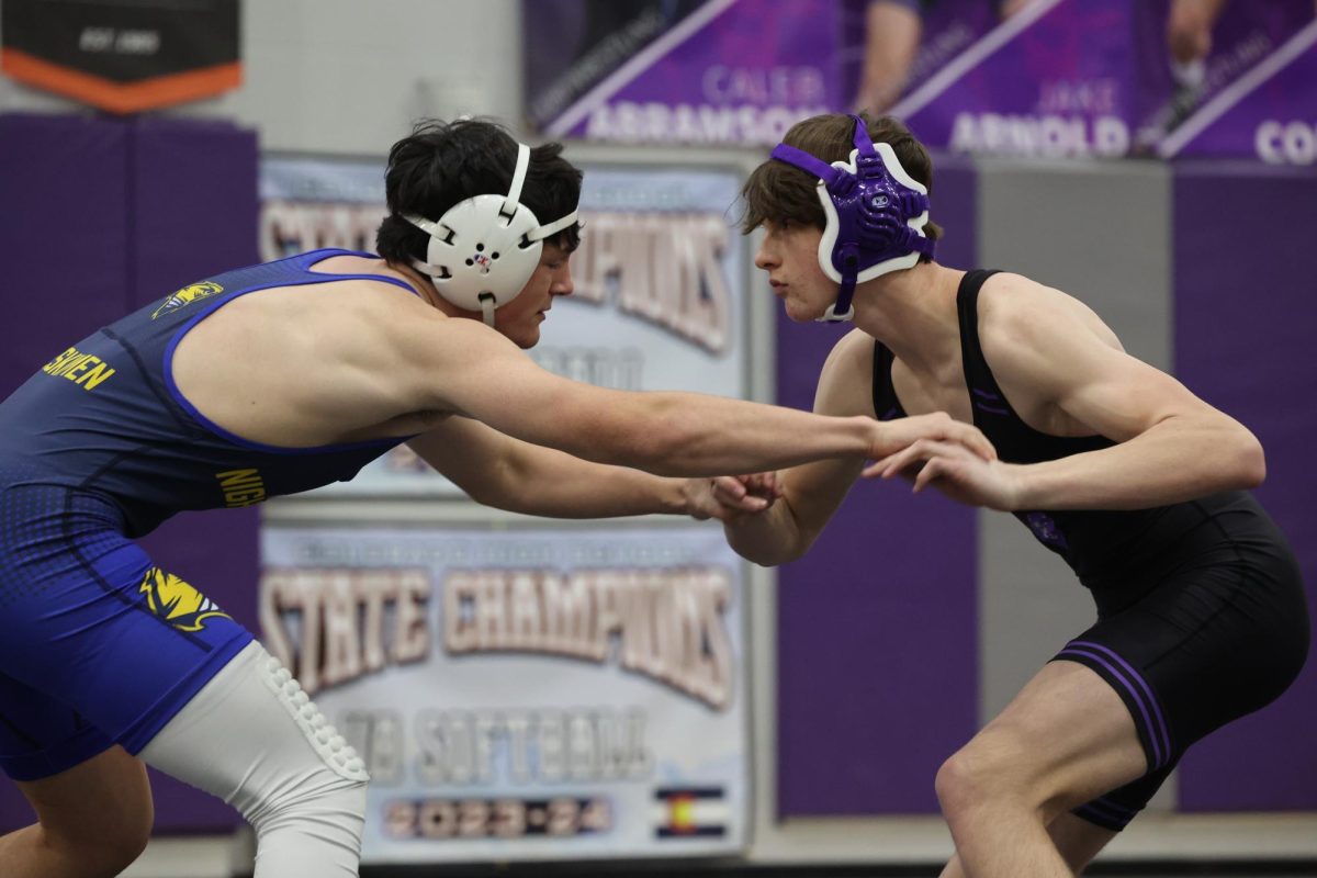 Varsity Wrestling at home dueling Northfield