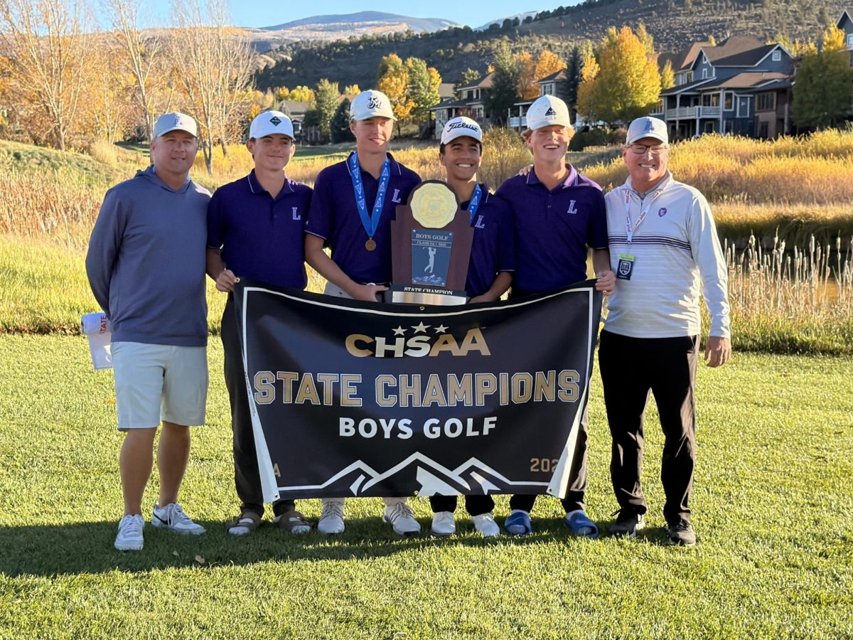 The Boys Golf Team pose with their CHSAA State Champions poster, celebrating their season finale