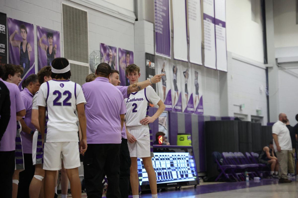 Lutheran Boy's Basketball team talking strategy in their game against Air Force Academy Cadets.